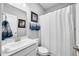 Clean, bright bathroom with a white vanity, framed mirror, and fresh, plush towels create a spa-like experience at 963 Booneway Ln, Bargersville, IN 46106