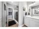 Bright bathroom featuring a glass-enclosed shower and a vanity with a white countertop at 963 Booneway Ln, Bargersville, IN 46106