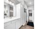 Bathroom showcasing white vanity cabinets, quartz countertop, and wood-look flooring at 963 Booneway Ln, Bargersville, IN 46106
