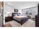 Bedroom showcasing a large bed with bedside tables, lamps, and a window with blinds at 963 Booneway Ln, Bargersville, IN 46106