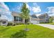 Charming home featuring a lush front lawn, professional landscaping, and a welcoming front entrance at 963 Booneway Ln, Bargersville, IN 46106