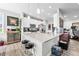 Bright kitchen featuring a stone countertop island with barstool seating and stainless steel appliances at 963 Booneway Ln, Bargersville, IN 46106