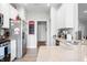 Spacious kitchen with stainless steel refrigerator and stove, and white cabinetry at 963 Booneway Ln, Bargersville, IN 46106