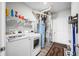 Efficient laundry room features a modern washer and dryer set and shelving for optimal storage and organization at 963 Booneway Ln, Bargersville, IN 46106