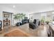 Bright living room featuring hardwood floors, a large TV, and comfortable seating at 963 Booneway Ln, Bargersville, IN 46106
