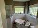 Charming bathroom with a standalone tub, white subway tiles, and natural light at 10 Sara Ct, Whiteland, IN 46184
