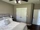 Neutral bedroom with white closet doors, ceiling fan, and comfortable bed with plush bedding at 10 Sara Ct, Whiteland, IN 46184