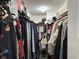 Walk-in closet with ample hanging space and clothing racks to organize your wardrobe at 10 Sara Ct, Whiteland, IN 46184
