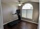 Home gym featuring a modern treadmill and natural light from the arched window at 10 Sara Ct, Whiteland, IN 46184