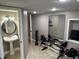 Bright home gym featuring a mirrored wall and a vanity with sink at 10 Sara Ct, Whiteland, IN 46184