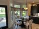Bright kitchen nook with a dark wood table, seating for four, and a bay window offering outdoor views at 10 Sara Ct, Whiteland, IN 46184