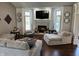 Cozy living room with a white fireplace, built-in shelving, plush seating, and natural light at 10 Sara Ct, Whiteland, IN 46184