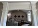 Comfortable living room featuring modern furnishings and an open view to the kitchen and dining area at 10 Sara Ct, Whiteland, IN 46184