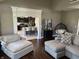 Comfortable living room featuring modern furnishings and an open view to the kitchen with bar seating at 10 Sara Ct, Whiteland, IN 46184