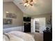 Main bedroom with vaulted ceilings, dark wood furniture, and two windows at 10 Sara Ct, Whiteland, IN 46184