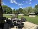 Backyard patio with outdoor seating, a fire pit, and a shed at 10 Sara Ct, Whiteland, IN 46184