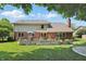Beautiful backyard featuring a large deck and well-manicured lawn, perfect for entertaining outdoors at 10418 Forest Creek Dr, Indianapolis, IN 46239