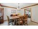 Dining room with wood furniture and view to living room at 10418 Forest Creek Dr, Indianapolis, IN 46239