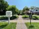 Charming front yard with landscaping and a glimpse of the inviting home at 10418 Forest Creek Dr, Indianapolis, IN 46239