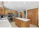 Bright kitchen with an island and access to the staircase at 10418 Forest Creek Dr, Indianapolis, IN 46239