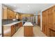 Open kitchen featuring custom cabinets, island, and stainless steel appliances at 10418 Forest Creek Dr, Indianapolis, IN 46239