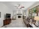 Living room featuring a fireplace, sofa, and TV at 10418 Forest Creek Dr, Indianapolis, IN 46239