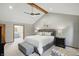 Bright main bedroom showcases a king bed, vaulted ceiling, and an en-suite bathroom for added privacy at 10418 Forest Creek Dr, Indianapolis, IN 46239