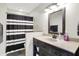 Bathroom featuring a vanity with unique sink and a shower with stylish black and white shower curtain at 10972 W Old Nashville Rd, Columbus, IN 47201