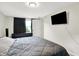 Bedroom with a comfortable bed, window view, and TV, offering a relaxing retreat at 10972 W Old Nashville Rd, Columbus, IN 47201