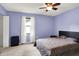Bedroom with a closet and neutral carpet and a light blue paint at 10972 W Old Nashville Rd, Columbus, IN 47201
