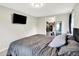 Bedroom with TV, closet, and minimalist decor, creating a clean and modern aesthetic at 10972 W Old Nashville Rd, Columbus, IN 47201