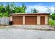 Spacious garage with two bays, featuring a side door and ample parking space, plus additional storage at 10972 W Old Nashville Rd, Columbus, IN 47201