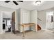 The living room leads to a 'Personal Cave' and bathroom, complemented by stairs to the upper level of the home at 10972 W Old Nashville Rd, Columbus, IN 47201