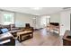 Cozy living room with a leather sectional, wood floors, and great natural lighting at 10972 W Old Nashville Rd, Columbus, IN 47201