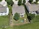 Aerial view of a home with a spacious backyard, play set, and patio at 11209 Black Gold Dr, Noblesville, IN 46060
