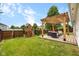 Beautiful backyard with a pergola, outdoor seating, and a playset at 11209 Black Gold Dr, Noblesville, IN 46060
