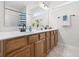 Bathroom features a double sink vanity, bright lighting, and neutral paint at 11209 Black Gold Dr, Noblesville, IN 46060