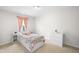 Cozy bedroom with a plush bed, light pink curtains, and a white three-drawer dresser at 11209 Black Gold Dr, Noblesville, IN 46060