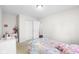 Inviting bedroom with a soft bed, white dresser, and a closet with sliding doors at 11209 Black Gold Dr, Noblesville, IN 46060