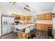 Bright kitchen features stainless steel appliances, center island, and ample counter space for cooking and entertaining at 11209 Black Gold Dr, Noblesville, IN 46060