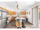 Modern kitchen with stainless steel appliances, a center island with seating, and ample counter space at 11209 Black Gold Dr, Noblesville, IN 46060