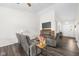 Relaxing living room with comfortable seating, wood accent wall, and an inviting fireplace feature at 11209 Black Gold Dr, Noblesville, IN 46060