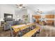 Open-concept living area with a dining table, fireplace, modern kitchen and integrated design at 11209 Black Gold Dr, Noblesville, IN 46060
