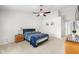 Spacious bedroom features a ceiling fan, neutral carpet and paint, and en suite bathroom at 11209 Black Gold Dr, Noblesville, IN 46060