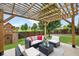 Inviting patio with a pergola, outdoor furniture, and a playset at 11209 Black Gold Dr, Noblesville, IN 46060