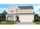 Charming two-story home features a covered front porch and a two-car garage at 1126 Bevy Blvd, Danville, IN 46122