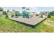 View of the community playground with slides and playground equipment surrounded by grass at 1126 Bevy Blvd, Danville, IN 46122