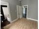 Inviting bedroom connected to bathroom with vinyl floors and neutral decor at 1164 Groff Ave, Indianapolis, IN 46222