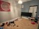 A cozy bedroom featuring hardwood floors, natural light, and a closet at 1164 Groff Ave, Indianapolis, IN 46222