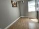 Comfortable bedroom with wood-look floors and ample natural light from a window at 1164 Groff Ave, Indianapolis, IN 46222